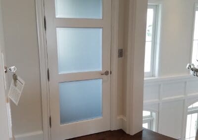 A door with decorative window films for the glass