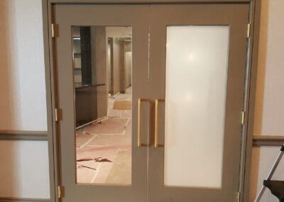 A double door with a partial decorative film