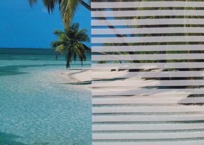 A split-image showing a tropical beach scene on the left and a set of horizontal blinds on the right.