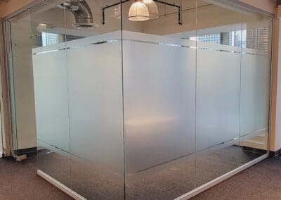 Modern office with glass partition walls.